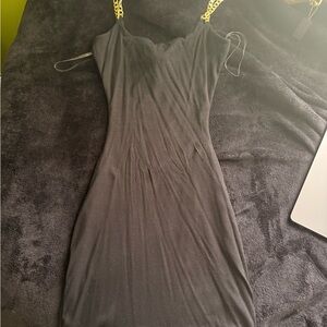 Elegant Black Dress with Gold Chain Straps